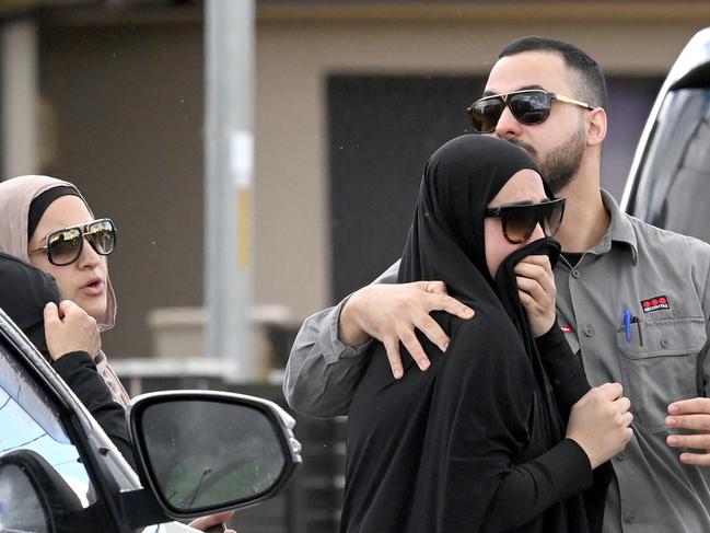 SYDNEY, AUSTRALIA - NewsWire Photos October 20 2021: Distressed family and friends at the scene of the shooting deaths of two Hamze family members in Guildford this morning.Picture: NCA NewsWire / Jeremy Piper