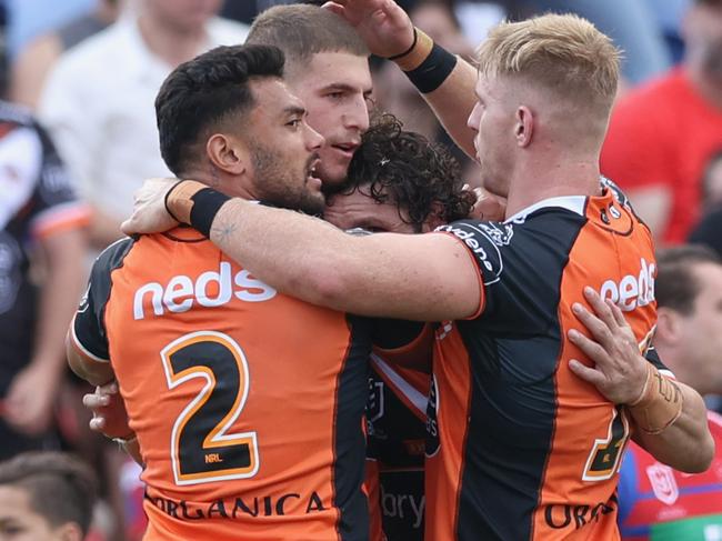 NEWCASTLE, AUSTRALIA - MARCH 28: Wests Tigers celebrate a try from Adam Doueihi during the round three NRL match between the Newcastle Knights and the Wests Tigers at McDonald Jones Stadium on March 28, 2021, in Newcastle, Australia. (Photo by Ashley Feder/Getty Images)