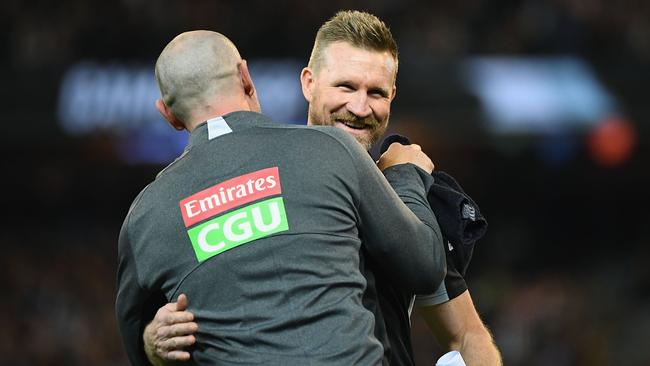 Nathan Buckley and Brenton Sanderson embrace after last week’s win against Richmond. Picture: Getty Images