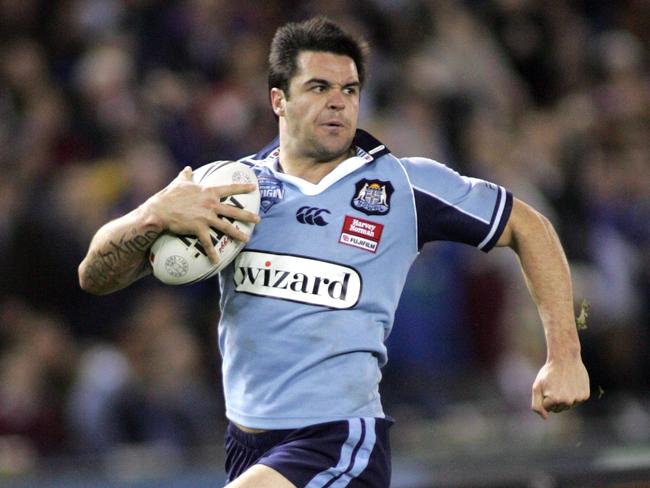 Eric Grothe races away to score during an Origin contest in Melbourne. Picture: David Crosling