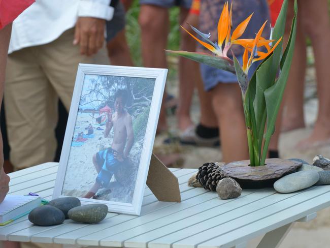 Fond farewell.... Tadashi’s photo at a makeshift beach memorial.