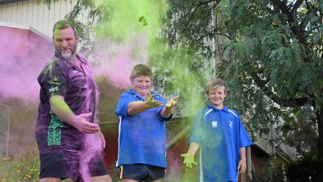 GETTING COLOURED: Sergeant Greg Caletti with Charlie and Cameron Brazier. INSET: The glimpse at the course map for this year's Senex ColourXplosion. Picture: Ellen Ransley