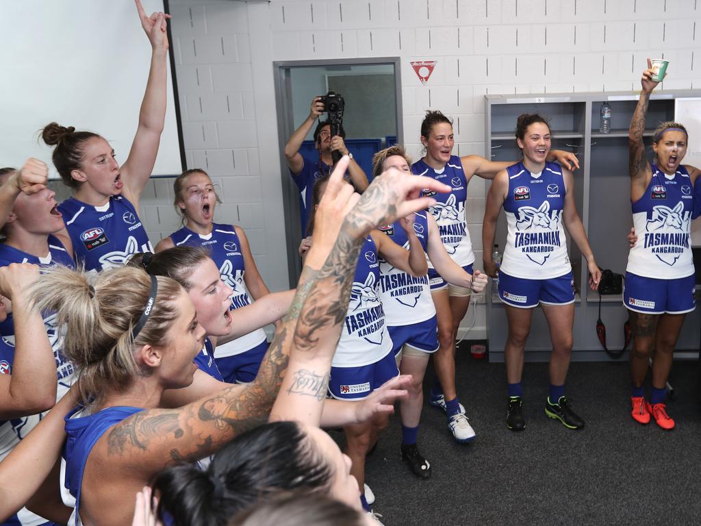 North Melbourne celebrate winning its first AFLW match, against Carlton at North Hobart Oval. Picture: LUKE BOWDEN