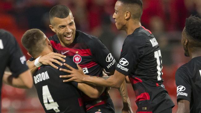 Jaushua Sotirio celebrates with teammates after scoring the Wanderers’ second goal. Picture: AAP