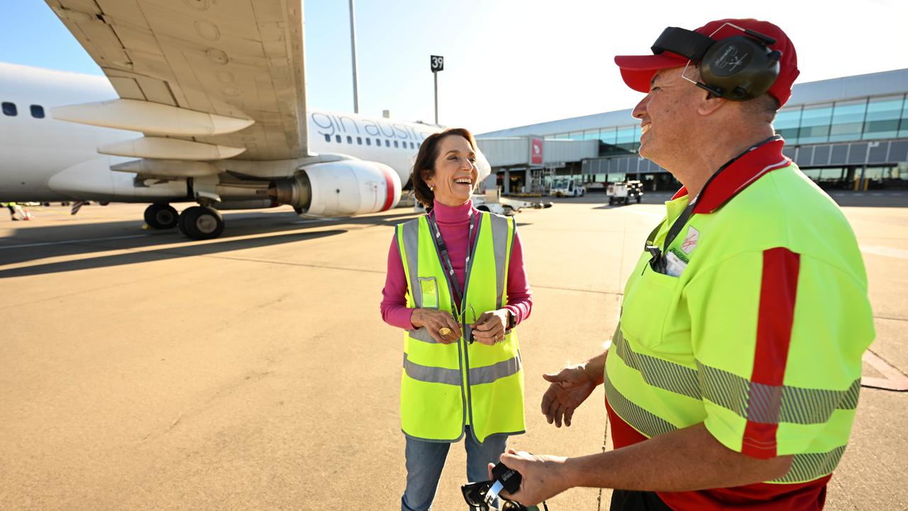 Virgin Australia’s Jayne Hrdlicka in a lighter moment with ground crew. Picture: Lyndon Mechielsen