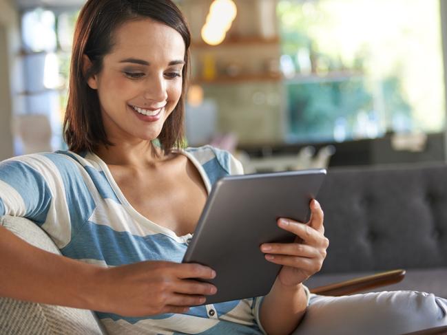 Shot of an attractive young woman relaxing at home with a digital tablethttp://195.154.178.81/DATA/istock_collage/0/shoots/784332.jpg