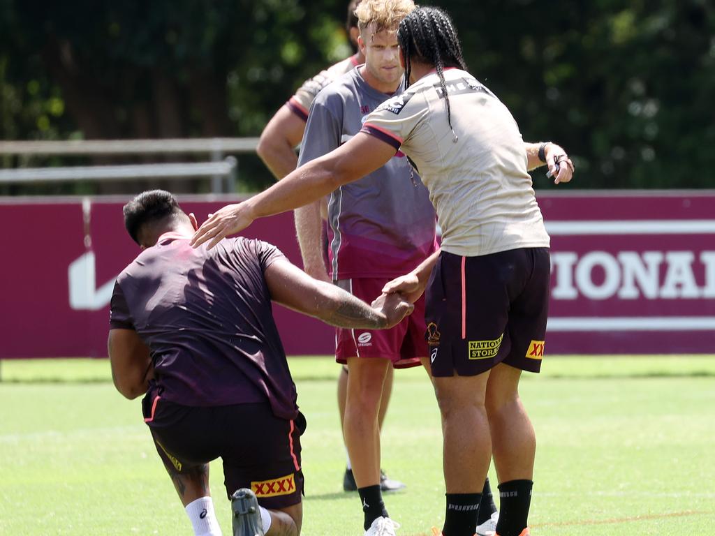 Marty Taupau helps Payne Haas up after a clash. Picture: Liam Kidston