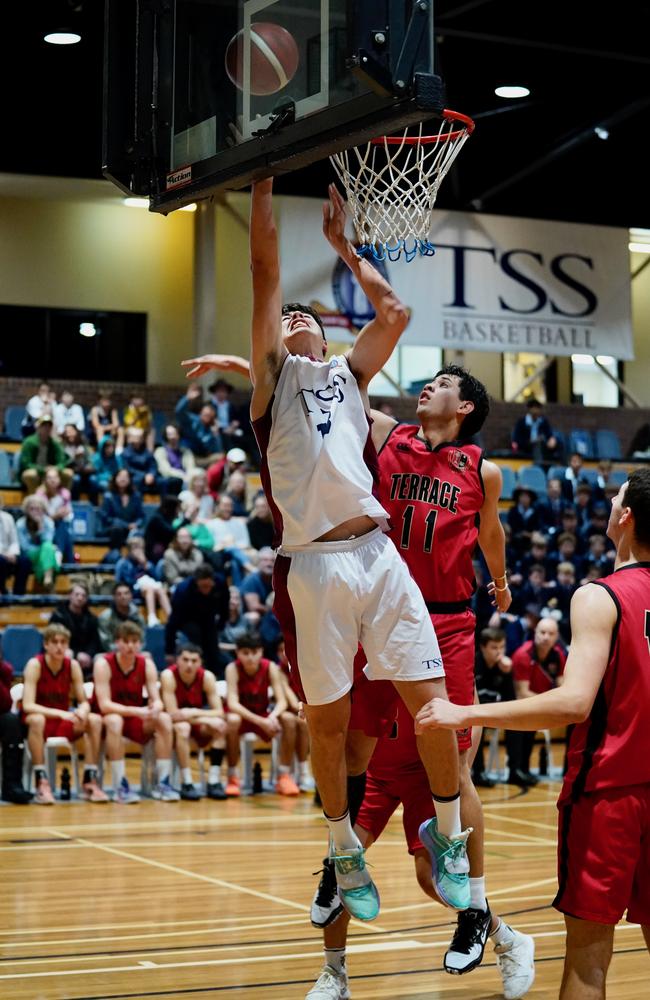 Ben Tweedy doing what he does best against Gregory Terrace. Pic: Heidi Brinsmead.