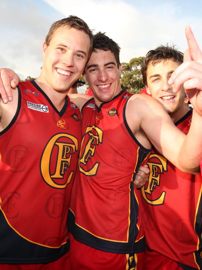 Nic Schwarz (middle) after winning the division three grand final with Flinders Park in 2011. Picture: Stephen Laffer