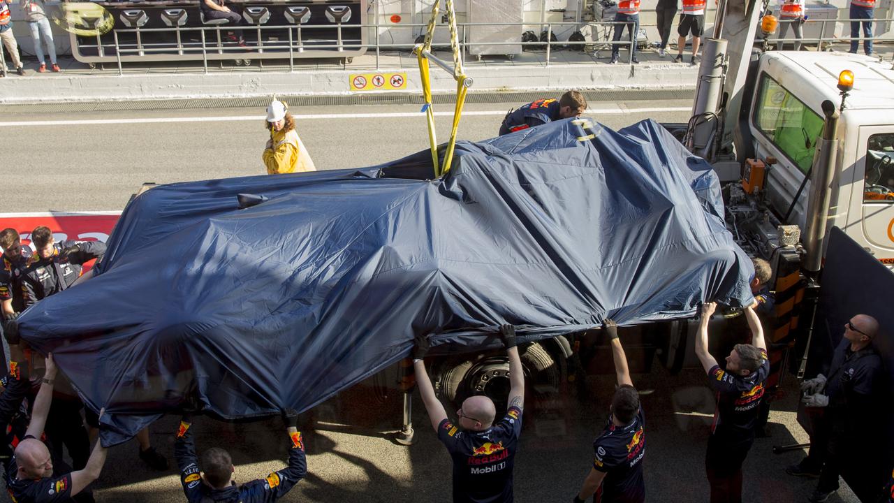 Pierre Gasly’s Red Bull was towed away after his big crash at Turn Nine in Barcelona.