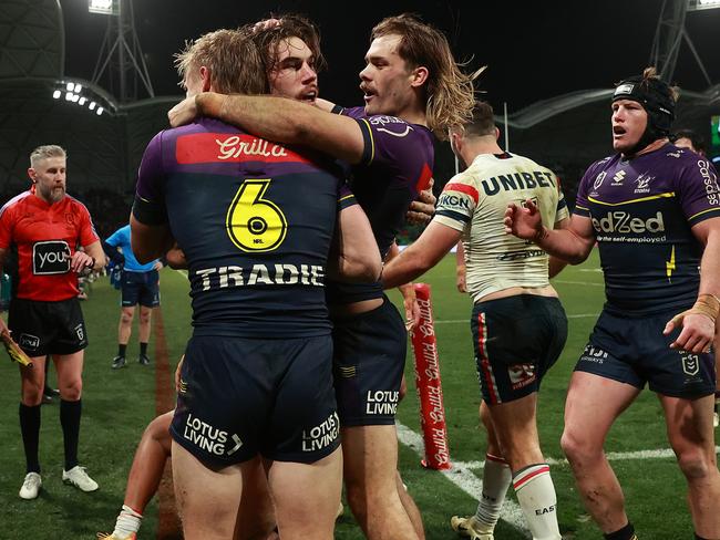 MELBOURNE, AUSTRALIA - JULY 20: Grant Anderson of the Storm celebrates with Ryan Papenhuyzen of the Storm after making a try saving tackle against Dominic Young of the Roosters during the round 20 NRL match between Melbourne Storm and Sydney Roosters at AAMI Park, on July 20, 2024, in Melbourne, Australia. (Photo by Kelly Defina/Getty Images)