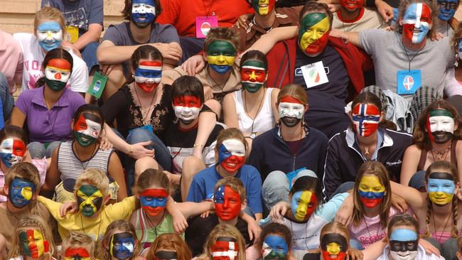 News BCM 1-8-04, World record set at Robina Town Centre for painting the world's flags on 50 faces. Pic Paul Riley