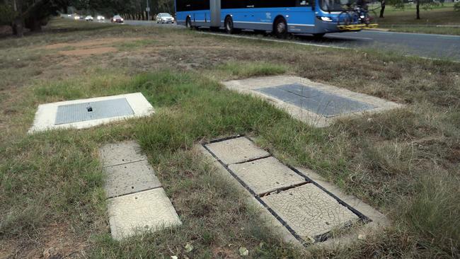 An unsecured Telstra pit in Canberra containing cabling that provides communication between government departments.