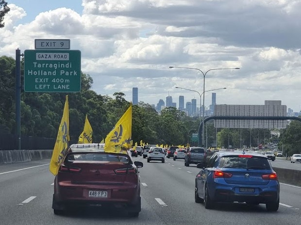 Drivers faced at least 30 minute delays as they tried to navigate around  a huge conga line of car's sporting the bright yellow Khalistan flag on Saturday. Picture: Georgia Clelland