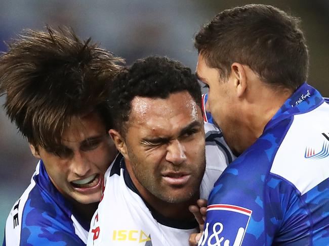 Justin O'Neill of the Cowboys is tackled by the Bulldogs defence during the Round 7 NRL match between the Canterbury Bulldogs and the North Queensland Cowboys at ANZ Stadium in Sydney, Friday, April 26, 2019.  (AAP Image/Brendon Thorne) NO ARCHIVING, EDITORIAL USE ONLY