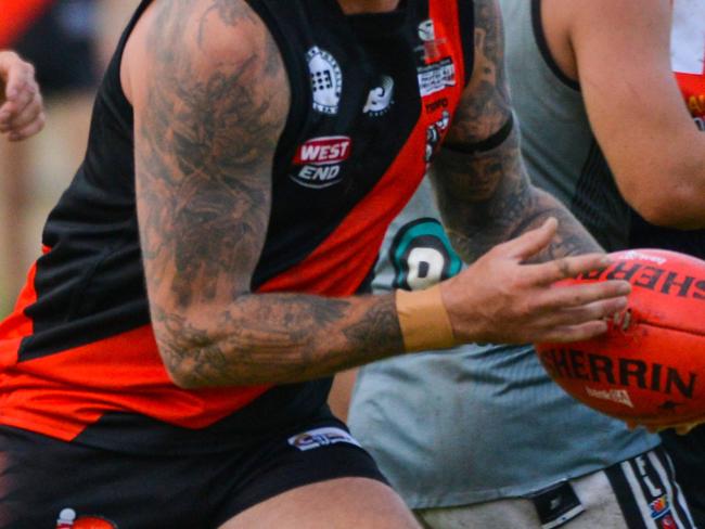 AMATEUR FOOTY: Tea Tree Gully v Port District at Banksia Park, Saturday, April 14, 2018. Tee Tree Gully's Adam Maschotta evades a tackle. (AAP Image/ Brenton Edwards)