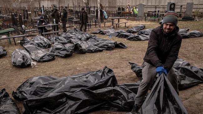 Emergency service personnel catalogue corpses in Bucha after the Russia military’s massacre of civilians. Picture: Getty Images.