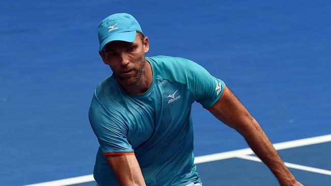 Croatia's Ivo Karlovic hits a return against Japan's Kei Nishikori during their men's singles match on day four of the Australian Open tennis tournament in Melbourne on January 17, 2019. (Photo by Greg Wood / AFP) / -- IMAGE RESTRICTED TO EDITORIAL USE - STRICTLY NO COMMERCIAL USE --