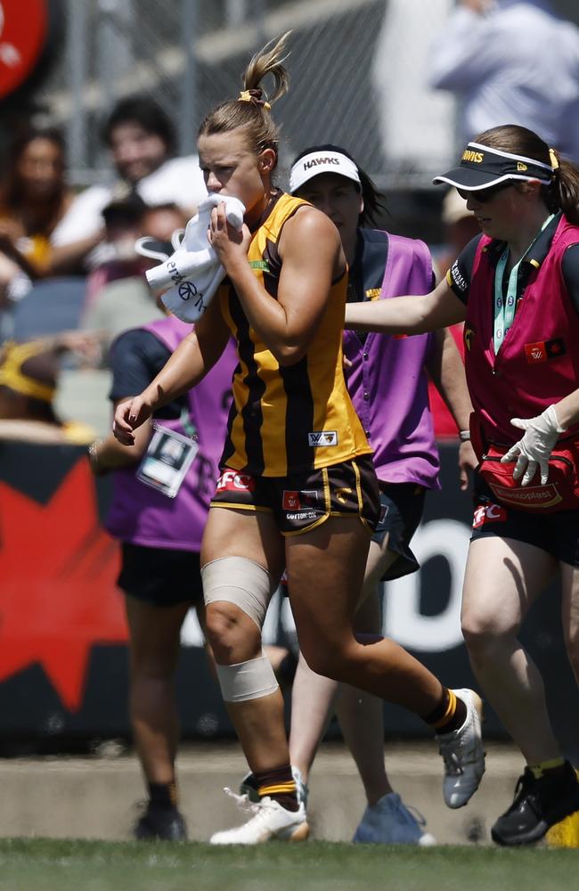 Hawthorn’s Ainslie Kemp heads to the bench after a big hit in the second quarter. Picture: Michael Klein