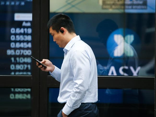 SYDNEY, AUSTRALIA - Newswire Photos October 31, 2022: Members of the public are seen walking past the ASX in Sydney. Picture: NCA Newswire / Gaye Gerard