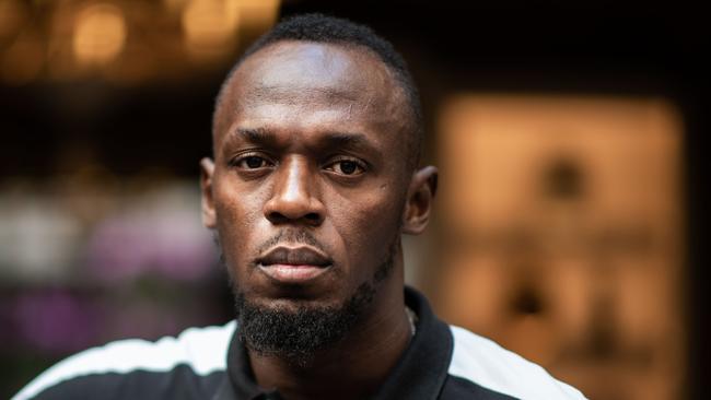 Usain Bolt could have lost millions. (Photo by Martin BUREAU / AFP)