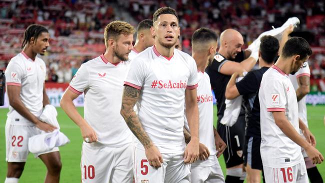 Sevilla's Argentinian forward #05 Lucas Ocampos wears a jersey reading 'It's over' referring to widespread outrage over the unsolicited kiss, prior to the Spanish Liga football match between Sevilla FC and Girona FC, in Seville. Picture: AFP