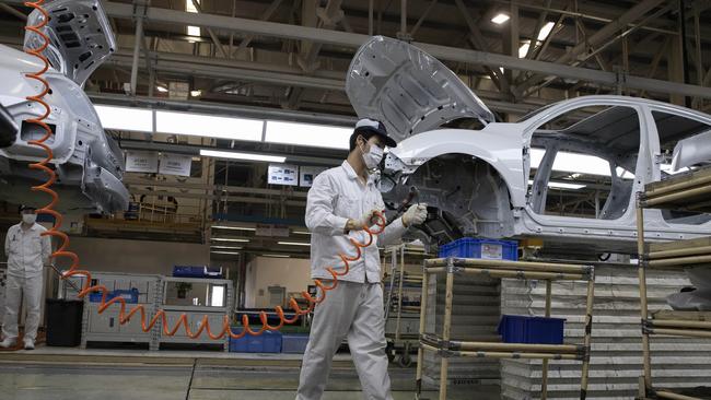 Workers at the Dongfeng Honda factory in Wuhan last week. Picture: AP