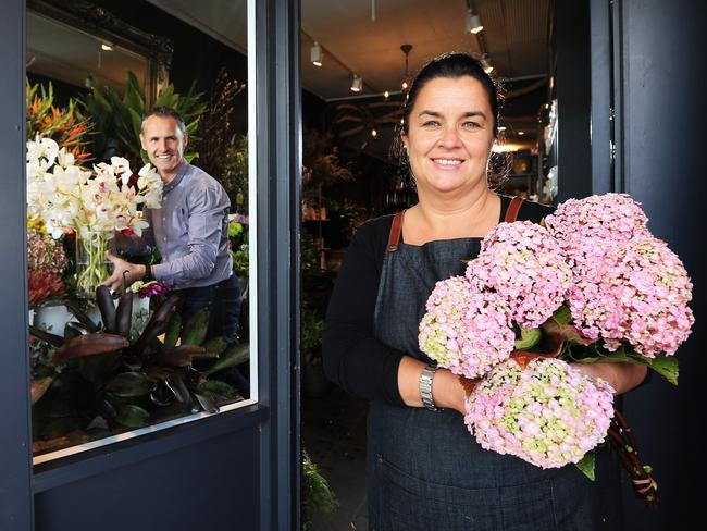 Stu White and Jodie McGregor at their florist shop in Annandale.                         Picture: Toby Zerna