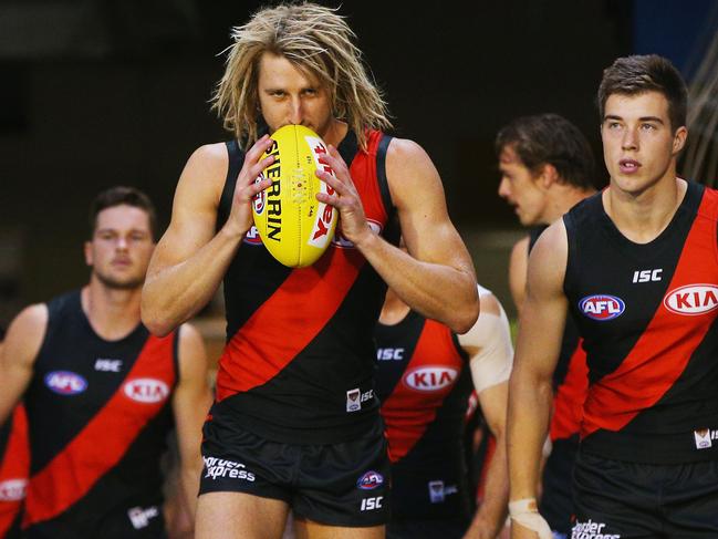 MELBOURNE, AUSTRALIA - MARCH 25: Dyson Heppell of the Bombers leads the team out during the round one AFL match between the Essendon Bombers and the Hawthorn Hawks at Melbourne Cricket Ground on March 25, 2017 in Melbourne, Australia. (Photo by Michael Dodge/Getty Images)