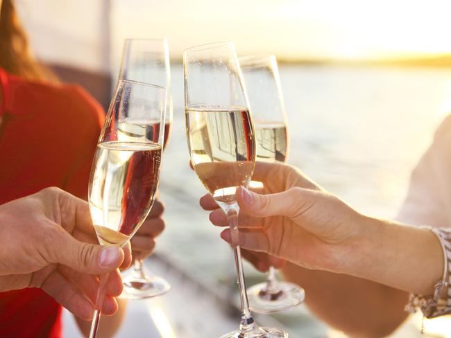 ESCAPE: Survive a Cruise, Carolyne Jasinski -  Happy friends with glasses of champagne on yacht. Vacation, travel, sea and friendship concept. Closeup. . Picture: iStock