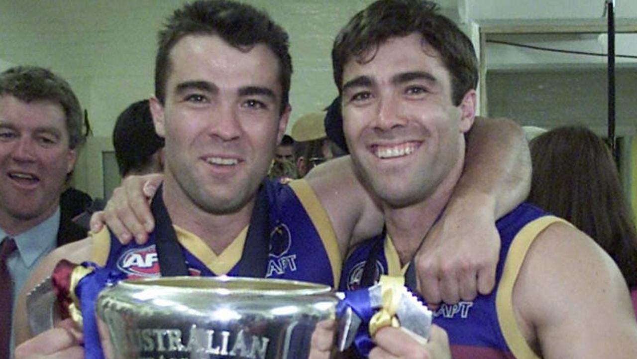 The Scott brothers with their first premiership cup after beating Essendon in 2001.