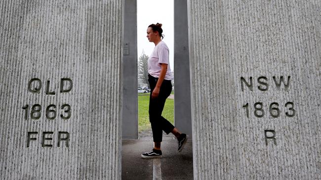 Freya Frenzel from Coolangatta at the NSW/Qld border marker. Picture: Adam Head