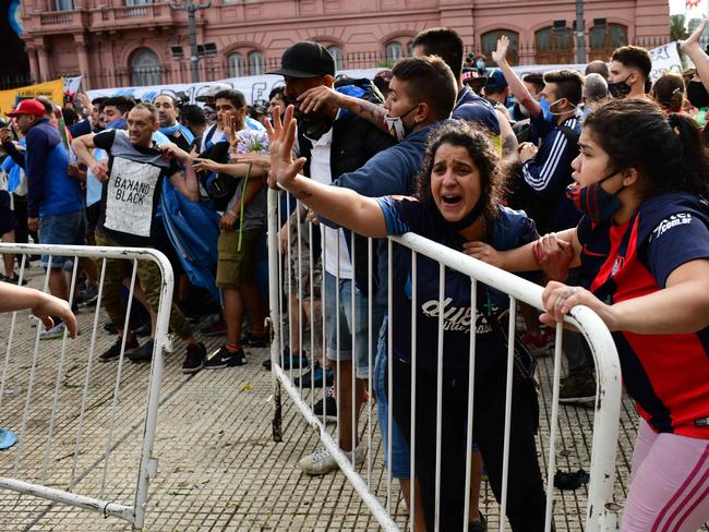 Fans try to get in to see Maradona.