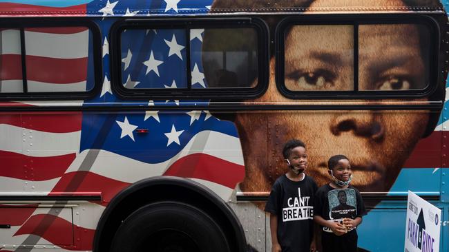 Children arrive to attend the public viewing for George Floyd’s body in Houston. Picture: AFP