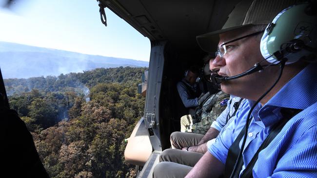 Prime Minister Scott Morrison looks on to bushfire affected area near Binna Burra in the Gold Coast Hinterland earlier this month.