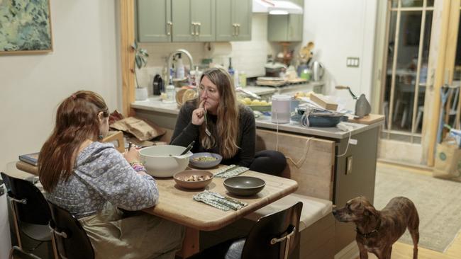 Birdie and her mother, Kait Handler, eat dinner together at their home. Tonight they are eating chicken and salad. Picture: Sarah Blesener for WSJ