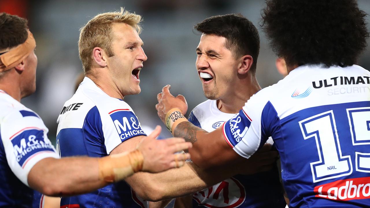 Jeremy Marshall-King of the Bulldogs celebrates scoring a try.