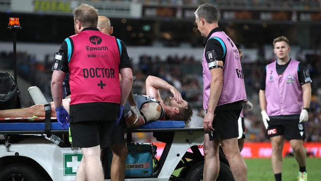 Trent McKenzie is stretchered off the field. Picture: Jono Searle/Getty