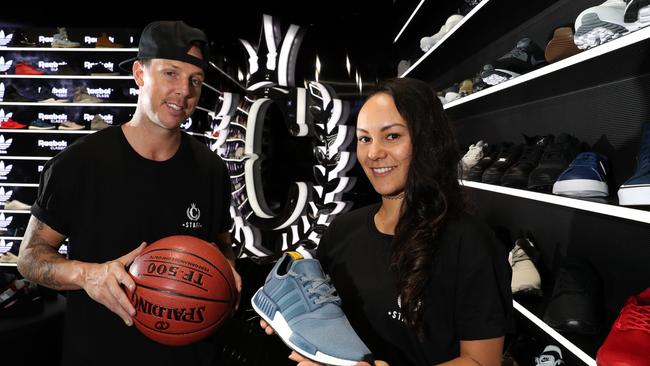 Culture Kings Pacific Fair staff Andy Wilson and Jacinta May show off the merchandise at the urbanwear chain’s new shop. Photo: Regi Varghese