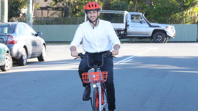 Mobike general manager Mina Nada takes one of his bikes for a spin. Photo Richard Gosling