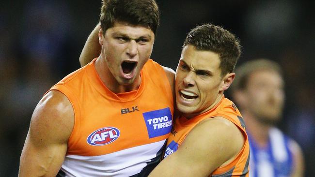 The Giants’ Jonathon Patton (left) celebrates a goal against North Melbourne on Saturday.