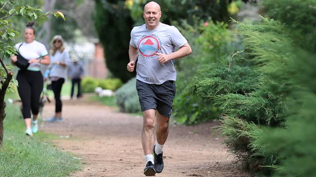 Federal Treasurer Josh Frydenberg running around Lake Burley Griffin in Canberra ahead of announcing his federal budget on Tuesday. Picture: NCA NewsWire / Gary Ramage