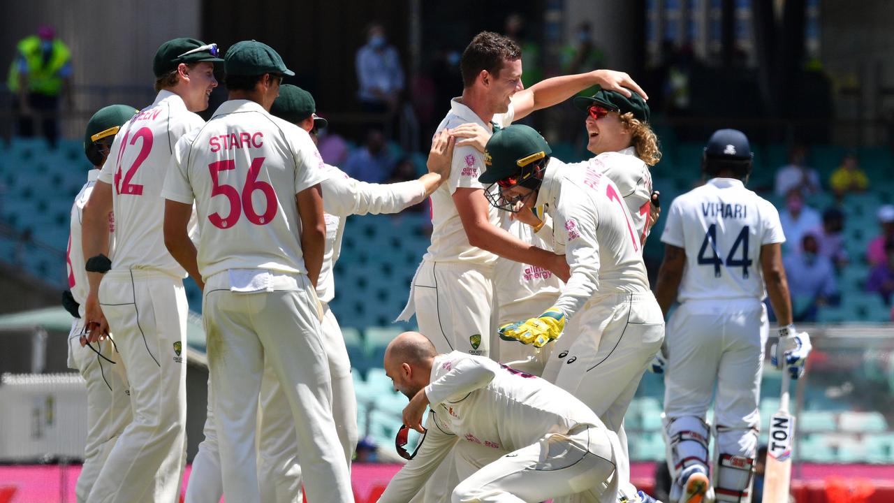 Australia's Josh Hazlewood celebrates the dismissal of Indian batsman Hanuma Vihari . (Photo by Saeed KHAN / AFP)