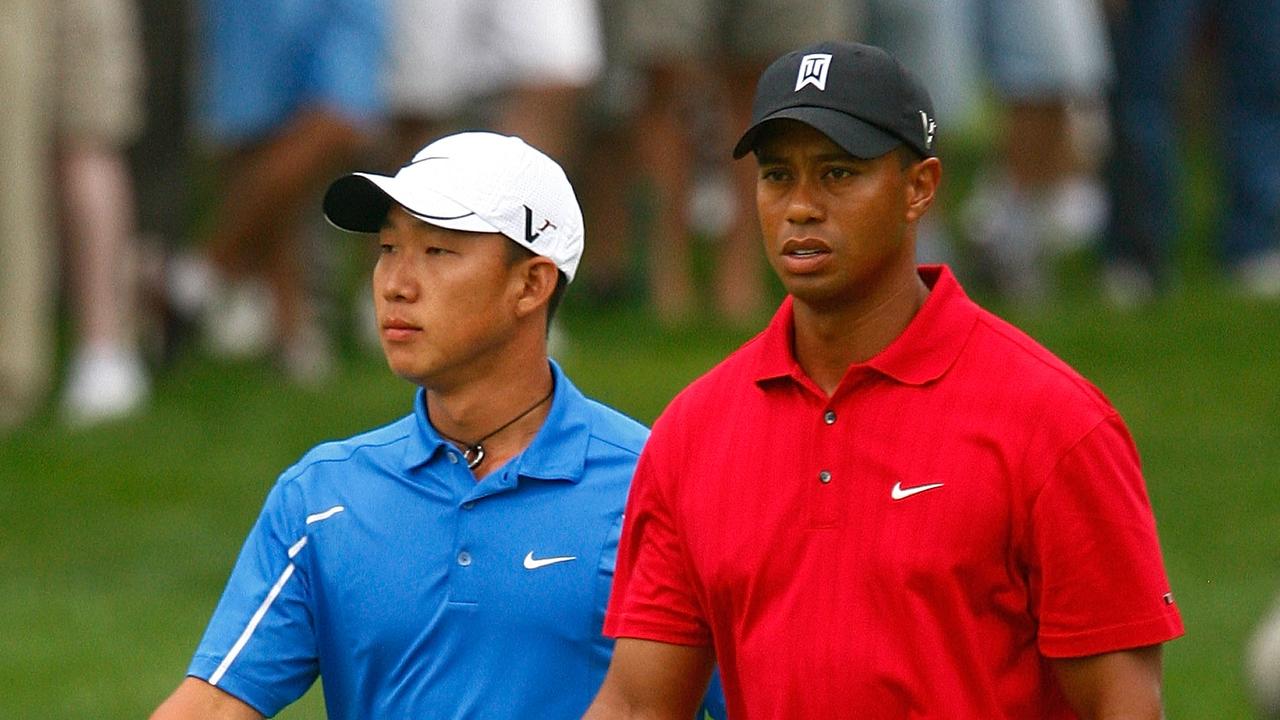 Tiger Woods walks with Anthony Kim. (Photo by Scott Halleran/Getty Images)