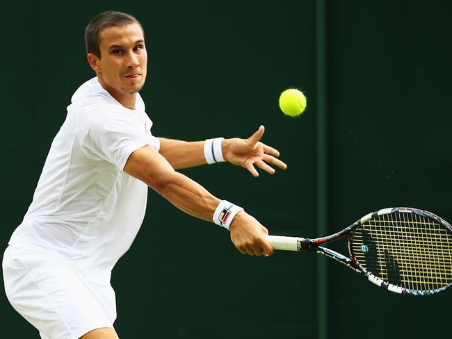 Bernard Tomic sails through to second round at Wimbledon after win over ...