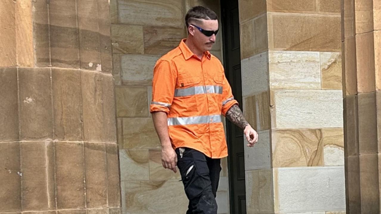 One of the alleged members of a criminal group, right, outside Adelaide Magistrates Court on Wednesday.