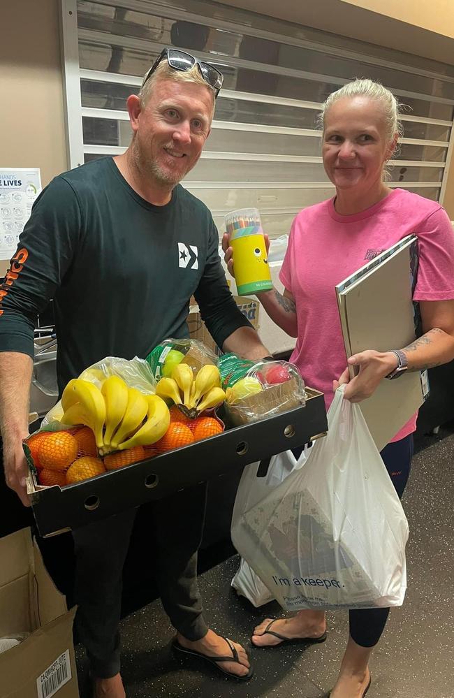 Whitsunday Civil owners Darren and Monica Piggot donating fruit and kids toys for flood-stranded travellers at Bowen PCYC, January 2023. Photo: Contributed