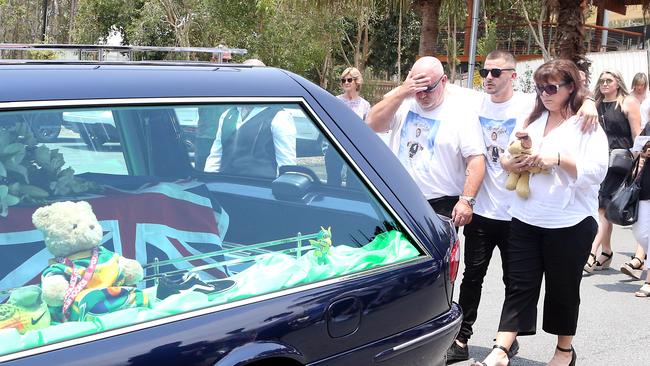 Jack Beasley’s older brother Mitch with parents Brett and Belinda Beasley at Jack’s funeral at Southport Church of Christ. Picture: AAP Image/Richard Gosling