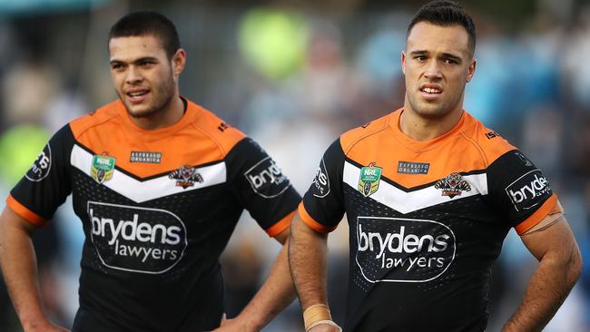 Tuimoala Lolohea and Luke Brooks look dejected after Wests Tigers’ defeat to the Sharks. Picture: Getty Images