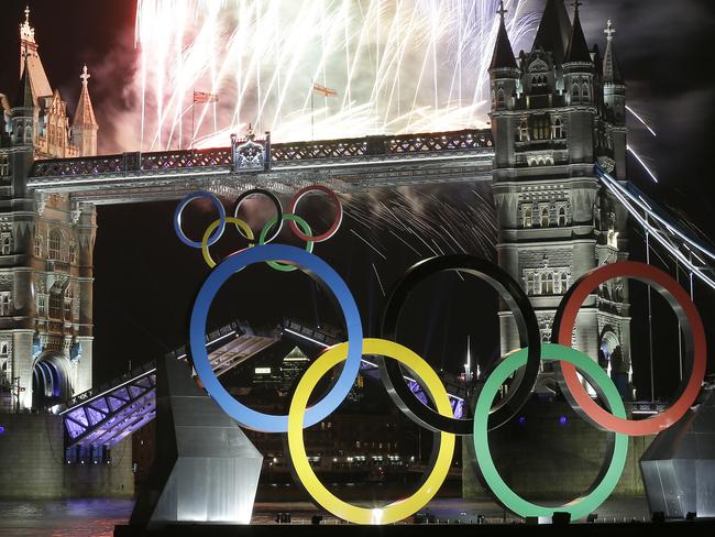 Fireworks light up Tower Bridge during the Opening Ceremony of the 2012 Summer Olympics, Friday, July 27, 2012, in London. (AP Photo/Alastair Grant)